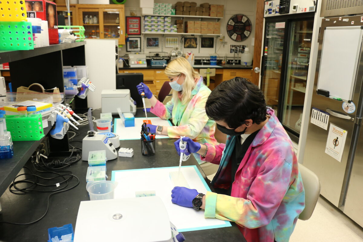 Emma Sweet DVMx’22, left, and Keegan Lim DVMx’24, right, conduct molecular biology experiments in the lab of School of Veterinary Medicine associate professor Rob Lipinski.