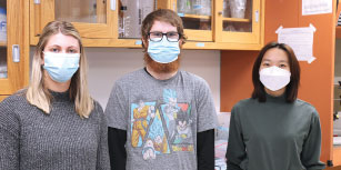 Ashley Kuehnl, Tyler Alvarez, and Yinghua Wang, left to right, are three scientists in training in the lab of Xuan Pan, an associate professor of oncology and veterinary clinician-scientist at the School of Veterinary Medicine.