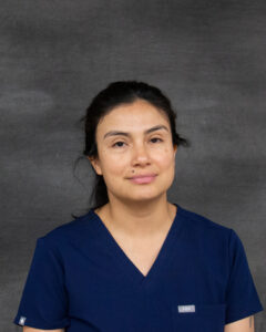 A black hair woman wear navy scrub top. Gabriela Landazuri Saltos
